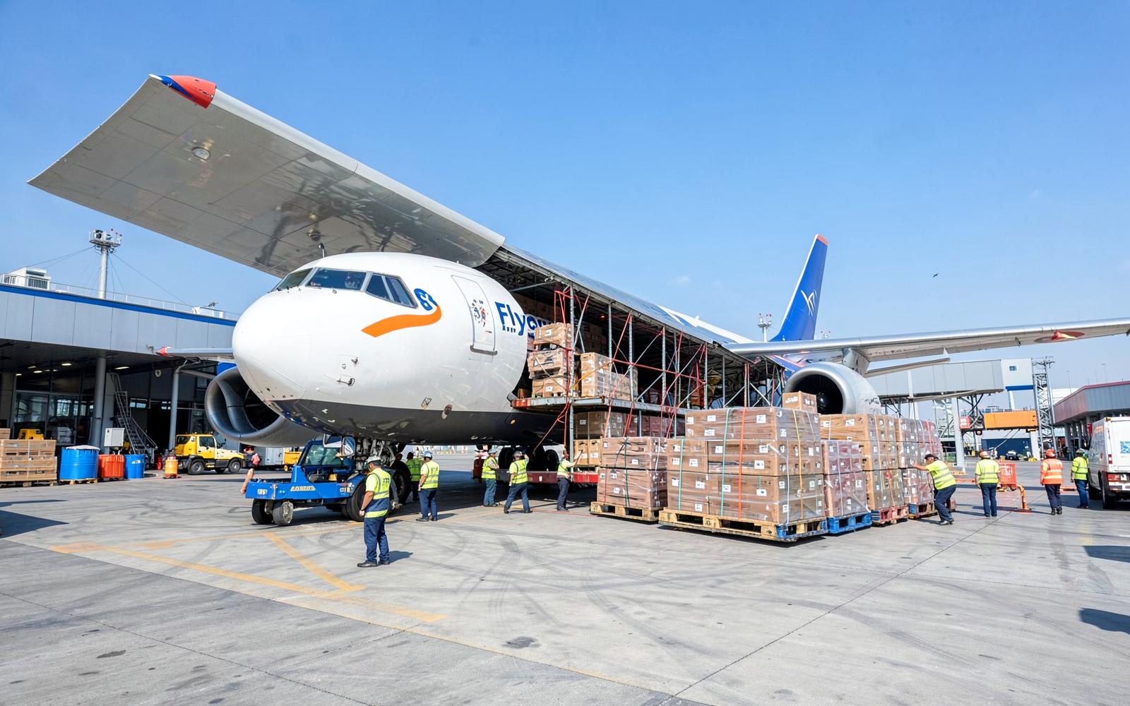 Cargo aircraft being loaded with commercial goods at a freight terminal